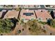 Aerial view of home with solar panels and lush landscaping at 26573 W Abraham Ln, Buckeye, AZ 85396