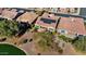 Aerial view of home with solar panels, near golf course and lake at 26573 W Abraham Ln, Buckeye, AZ 85396