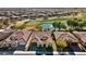 Aerial view of home, highlighting its desirable location near a pond and golf course at 26573 W Abraham Ln, Buckeye, AZ 85396