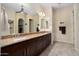 Spa-like bathroom with double sinks and large mirror at 26573 W Abraham Ln, Buckeye, AZ 85396