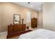 Bedroom with dresser, mirror, and large closet at 26573 W Abraham Ln, Buckeye, AZ 85396