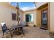 Private courtyard with patio furniture, creating an inviting outdoor space at 26573 W Abraham Ln, Buckeye, AZ 85396