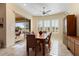 Bright dining room with sliding glass doors leading to a patio at 26573 W Abraham Ln, Buckeye, AZ 85396