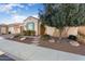 House exterior showcasing a large tree and well-maintained landscaping at 26573 W Abraham Ln, Buckeye, AZ 85396