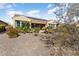 Single-story home with solar panels and desert landscaping at 26573 W Abraham Ln, Buckeye, AZ 85396