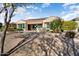 Single-story home with solar panels and desert landscaping at 26573 W Abraham Ln, Buckeye, AZ 85396