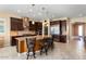 Gourmet kitchen with island, stainless steel appliances, and granite countertops at 26573 W Abraham Ln, Buckeye, AZ 85396