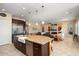Kitchen features a large island with seating and a farmhouse sink at 26573 W Abraham Ln, Buckeye, AZ 85396