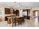 Gourmet kitchen with island, stainless steel appliances, and granite countertops at 26573 W Abraham Ln, Buckeye, AZ 85396