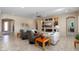 Open living area featuring built-in shelving and a large TV at 26573 W Abraham Ln, Buckeye, AZ 85396