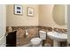 Chic powder room with tile flooring and modern vanity at 26573 W Abraham Ln, Buckeye, AZ 85396