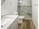 Clean bathroom featuring a walk-in shower and updated vanity at 37803 W La Paz St, Maricopa, AZ 85138