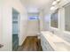 Bathroom with double vanity, soaking tub and walk-in closet at 37803 W La Paz St, Maricopa, AZ 85138