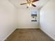 Bright bedroom with carpeted floors and a window at 37803 W La Paz St, Maricopa, AZ 85138