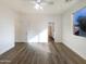Simple bedroom with wood-look floors and neutral color palette at 37803 W La Paz St, Maricopa, AZ 85138