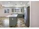 Modern kitchen island with white countertop and gray cabinets at 37803 W La Paz St, Maricopa, AZ 85138