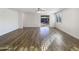 Spacious living area with wood-look flooring and sliding glass doors at 37803 W La Paz St, Maricopa, AZ 85138