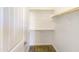 Spacious walk-in closet with shelving and hanging rods at 37803 W La Paz St, Maricopa, AZ 85138