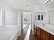 Bathroom with a bathtub, double vanity, and walk-in shower at 37855 W Merced St, Maricopa, AZ 85138