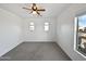 Bright bedroom with ceiling fan and carpet flooring at 37855 W Merced St, Maricopa, AZ 85138