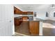 Modern kitchen with dark wood cabinets and granite countertops at 37855 W Merced St, Maricopa, AZ 85138