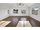 Spacious living area with large windows and tile floors at 37855 W Merced St, Maricopa, AZ 85138