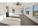 Bright main bedroom with large windows and plush carpeting at 37855 W Merced St, Maricopa, AZ 85138