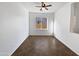 Empty spare bedroom with large window and tile flooring at 37855 W Merced St, Maricopa, AZ 85138
