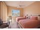 Two twin beds in a well-lit bedroom with balcony access at 3800 S Cantabria Cir # 1029, Chandler, AZ 85248