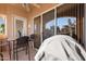 Covered patio with table and chairs, overlooking golf course at 3800 S Cantabria Cir # 1029, Chandler, AZ 85248