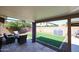 Backyard featuring chairs, green turf and a grill at 6352 W Campo Bello Dr, Glendale, AZ 85308