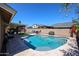 Inviting backyard pool with a covered patio and lounge area, perfect for outdoor relaxation at 6352 W Campo Bello Dr, Glendale, AZ 85308
