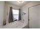 Inviting bathtub area with a window providing natural light and charming nautical decorations at 6352 W Campo Bello Dr, Glendale, AZ 85308