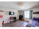 Bedroom features hardwood floors, a TV, and a trundle daybed at 6352 W Campo Bello Dr, Glendale, AZ 85308