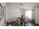 Cozy dining room featuring a wooden table with chairs, light fixture, and neutral decor, creating a comfortable setting at 6352 W Campo Bello Dr, Glendale, AZ 85308
