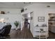 Bright entryway featuring wood-look floors, white walls, and an open view to the living room and dining area at 6352 W Campo Bello Dr, Glendale, AZ 85308