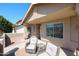 Inviting front porch with seating and a view of the home's facade at 6352 W Campo Bello Dr, Glendale, AZ 85308