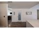 Hallway view showcases a pantry door and sign, flowing into the living area with modern design elements at 6352 W Campo Bello Dr, Glendale, AZ 85308