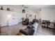 Open-concept living room with modern flooring, neutral walls, and plenty of space for comfortable seating and entertaining at 6352 W Campo Bello Dr, Glendale, AZ 85308