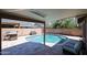 Covered patio with view of backyard pool at 6352 W Campo Bello Dr, Glendale, AZ 85308