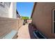 Narrow side yard with gravel and some storage next to a block wall at 6352 W Campo Bello Dr, Glendale, AZ 85308