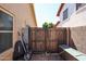 Side yard with gravel, storage and gated access to the front and back yards at 6352 W Campo Bello Dr, Glendale, AZ 85308