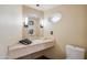 Well-lit bathroom featuring a marble countertop and modern fixtures at 6411 S River Dr # 10, Tempe, AZ 85283