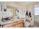Modern bathroom with marble countertops, pendant lighting, and tiled shower at 6411 S River Dr # 10, Tempe, AZ 85283