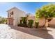 View of the home's exterior, showing the garage and landscaping at 6411 S River Dr # 10, Tempe, AZ 85283