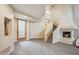 Elegant living room with a spiral staircase, a cozy fireplace, and a neutral color palette at 6411 S River Dr # 10, Tempe, AZ 85283
