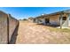 Large backyard with covered patio and block wall at 6427 W Turquoise Ave, Glendale, AZ 85302