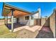 Backyard with covered patio and gate access at 6427 W Turquoise Ave, Glendale, AZ 85302