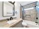 Updated bathroom with granite vanity and a tiled shower/tub combo at 6427 W Turquoise Ave, Glendale, AZ 85302