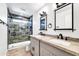 Updated bathroom with double vanity and a walk-in shower at 6427 W Turquoise Ave, Glendale, AZ 85302